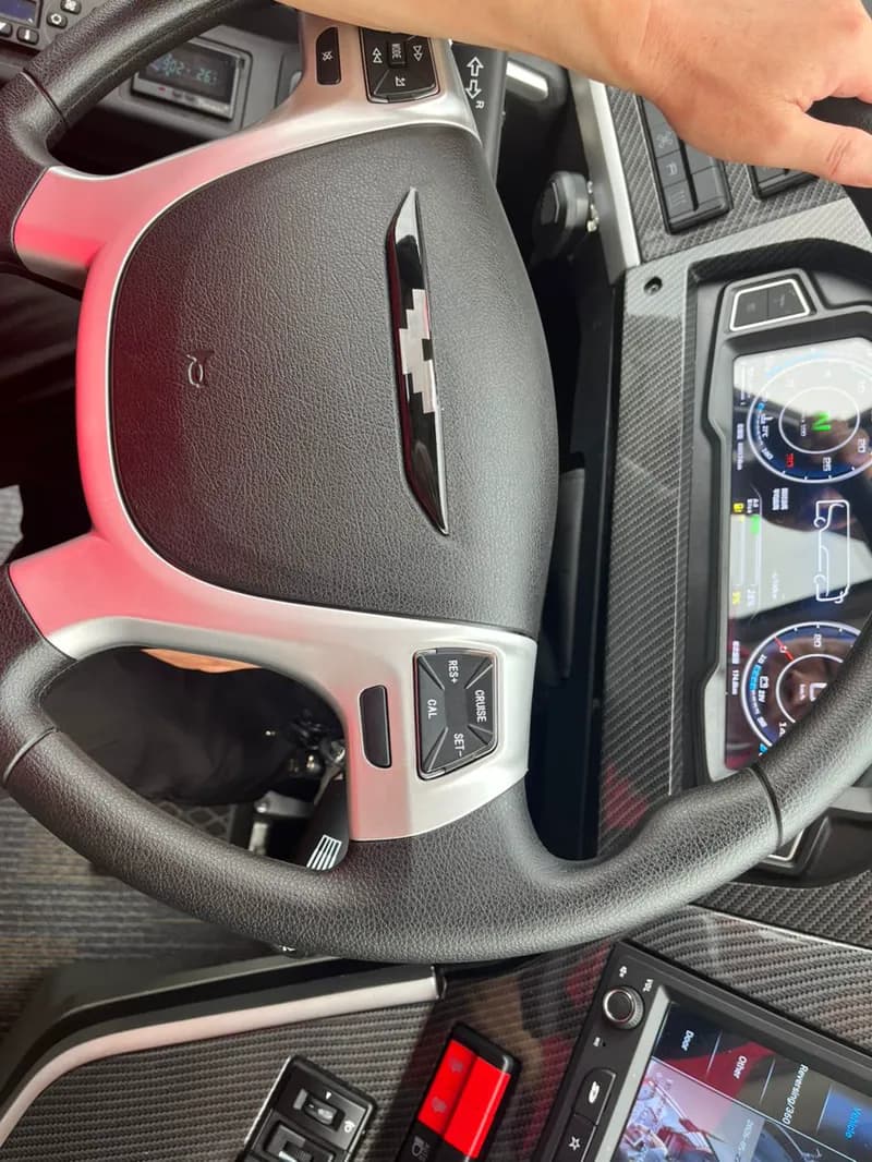 Electric bus driver cockpit with digital cluster and reversing camera